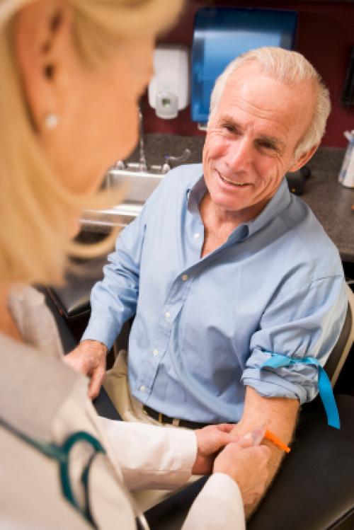 nurse taking patients blood